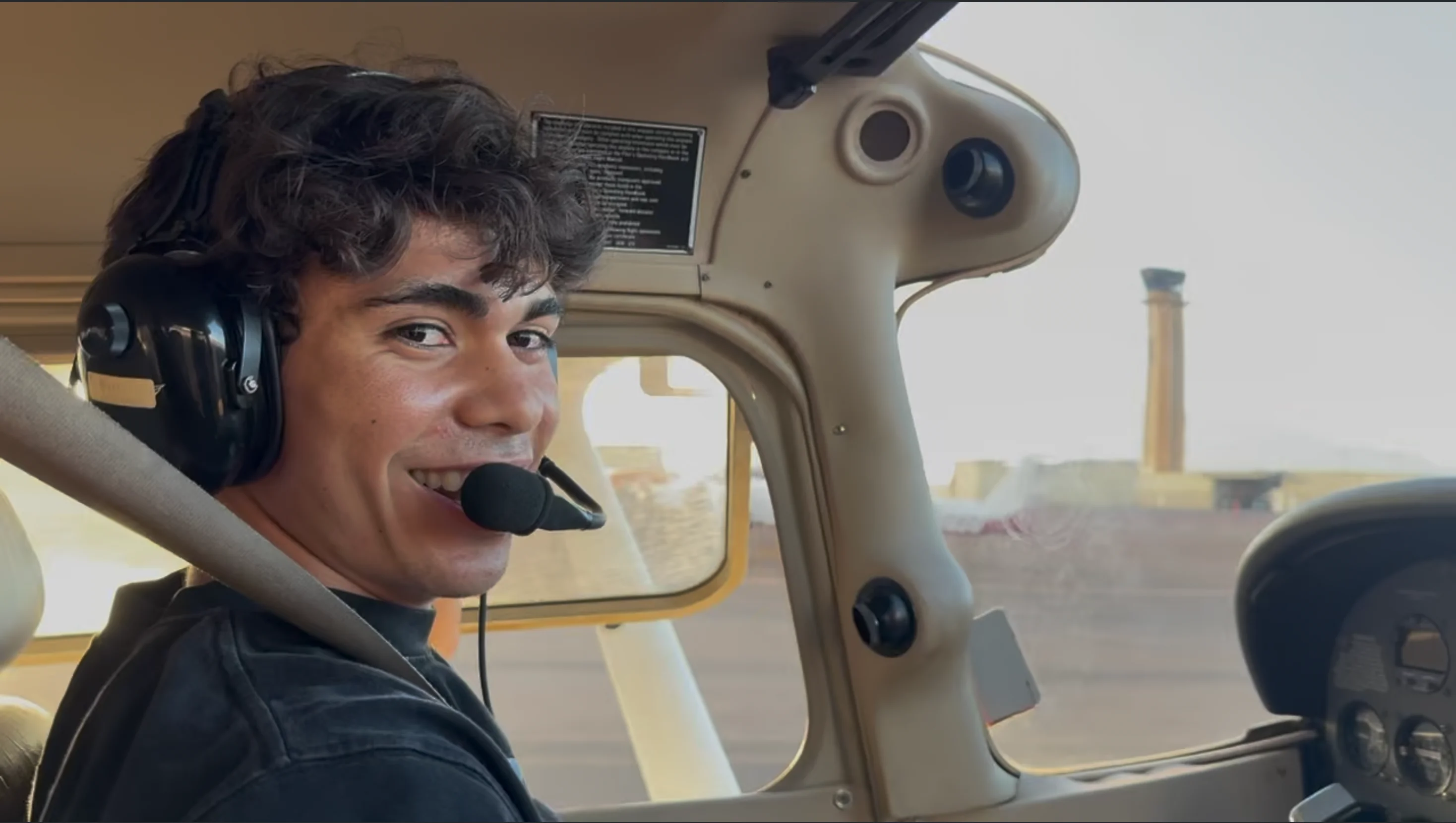 Aiden in the cockpit during a flight.